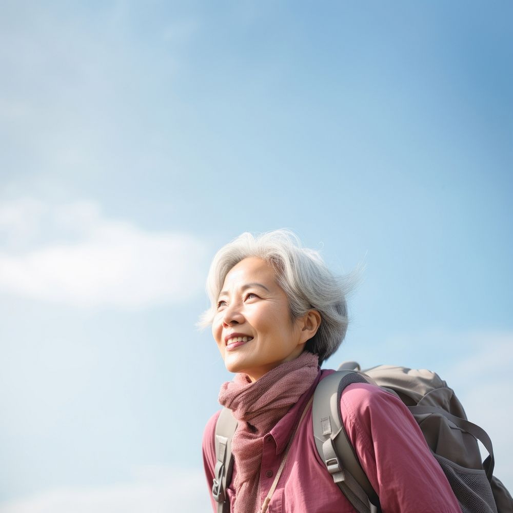 Senior woman hiking portrait outdoors backpack. 