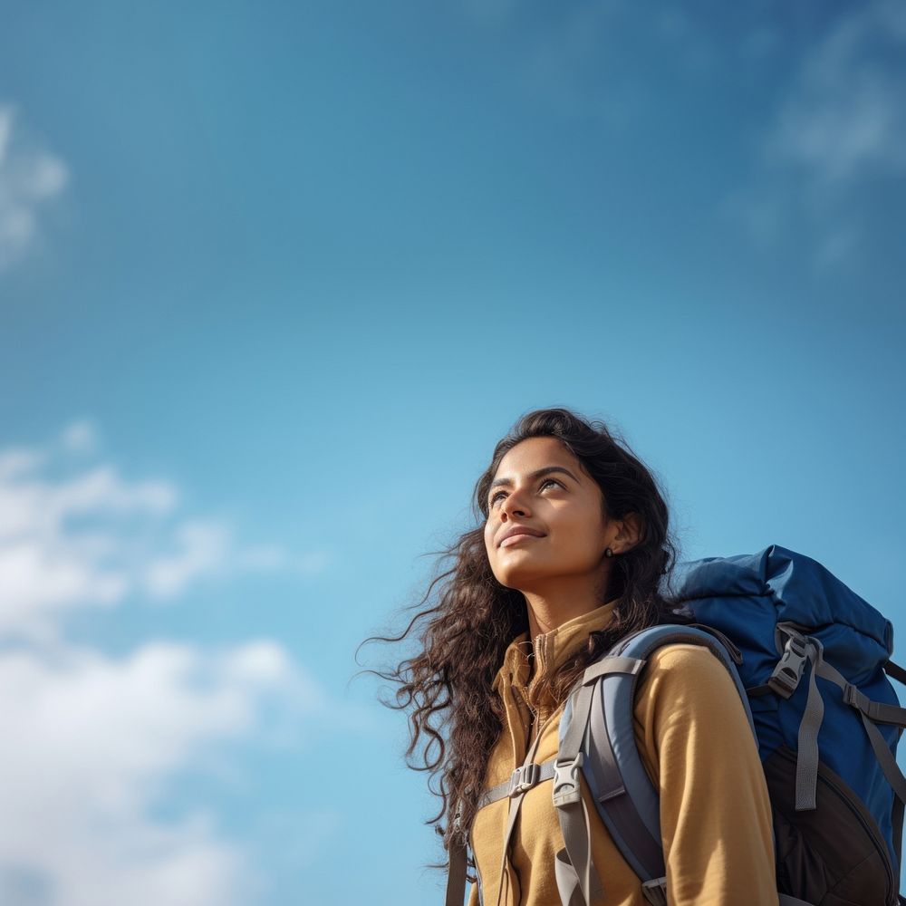 Indian woman hiking backpack looking blue. AI generated Image by rawpixel.