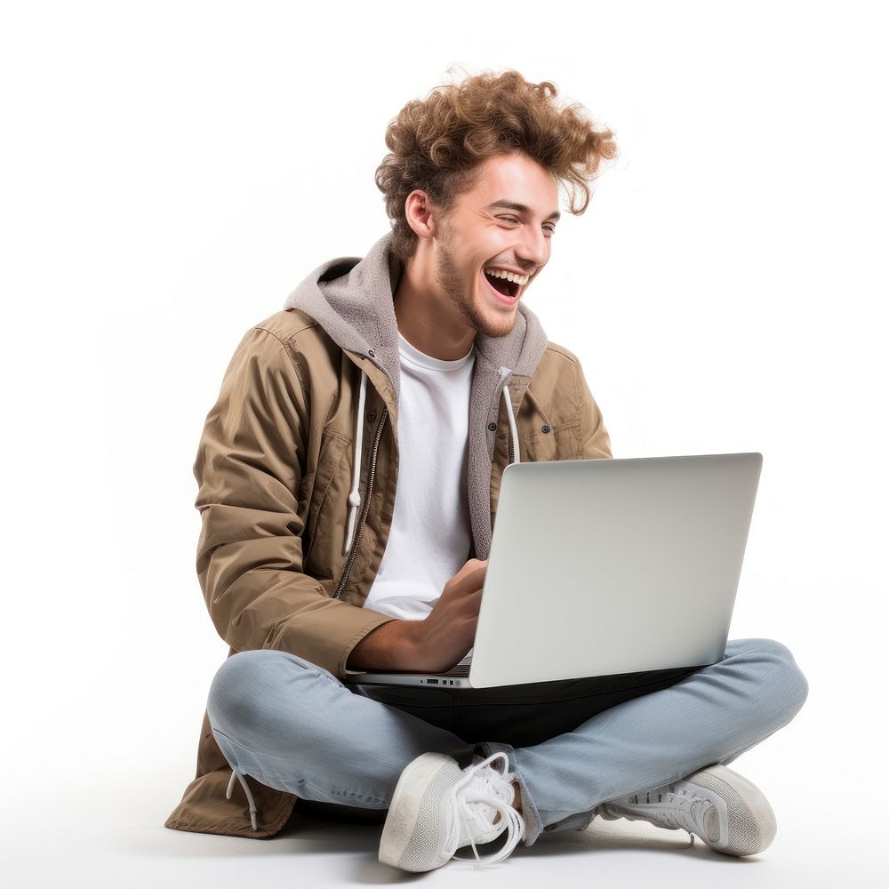 Male student sitting laptop laughing. AI generated Image by rawpixel.