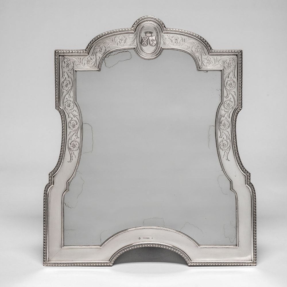 Vanity mirror in a silver frame with the alliance coat of arms of hugo moritz de saint-genois and eleonora von wachtler