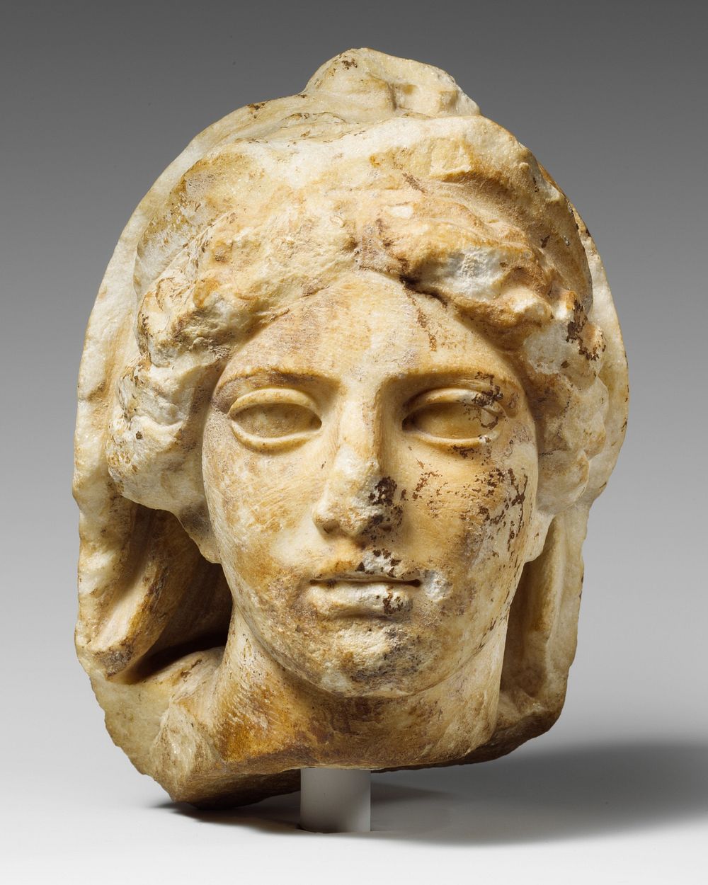 Marble head of a woman wearing diadem and veil