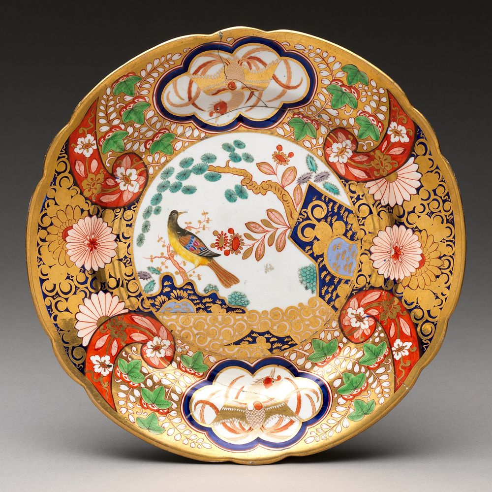 Plate with rocks, flowers, and birds