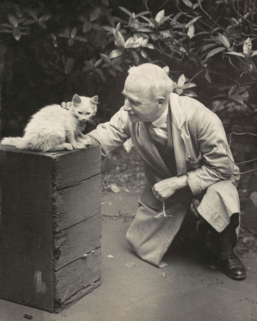 Man with a kitten (circa 1935-1939) by Marion Queenie Kirker.