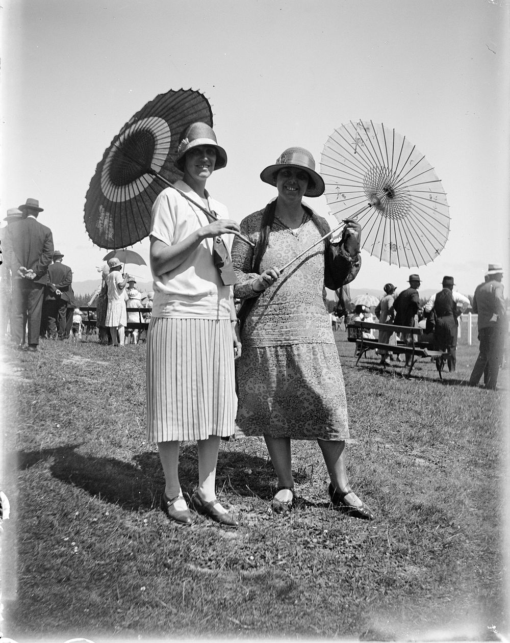 Two women with parasols (circa 1925) by Leslie Adkin.