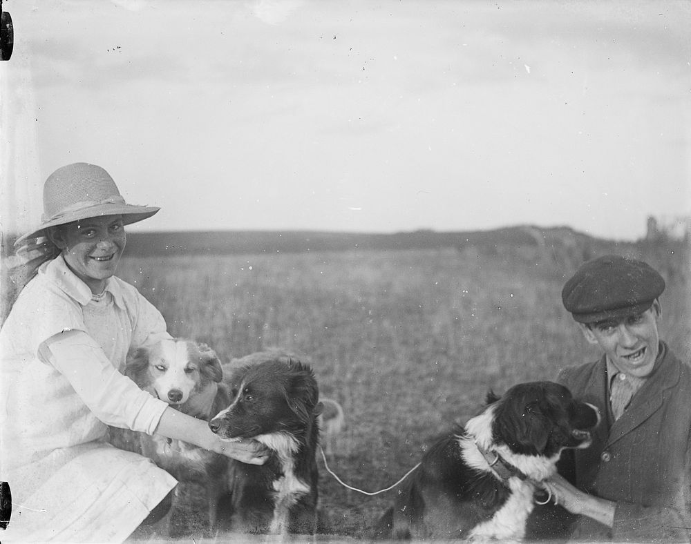 Man, woman and 3 dogs - view in close up by Crombie and Permin.
