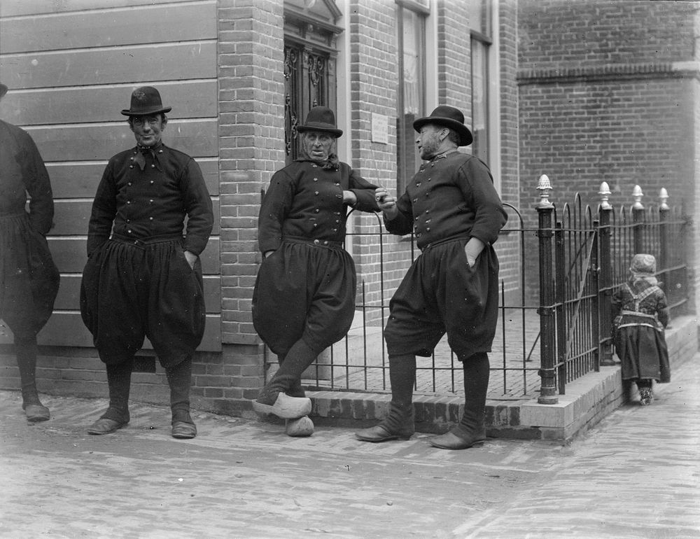 Men on street, the Netherlands (1906-1917) by George Crombie.