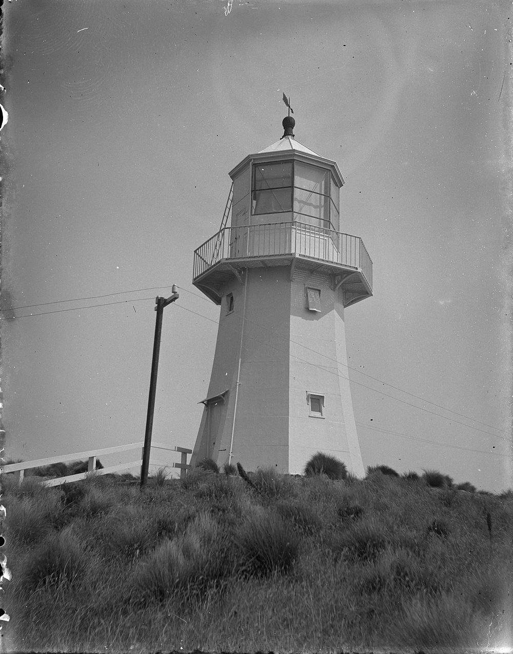 Pencarrow lighthouse (circa 1909) by Fred Brockett.