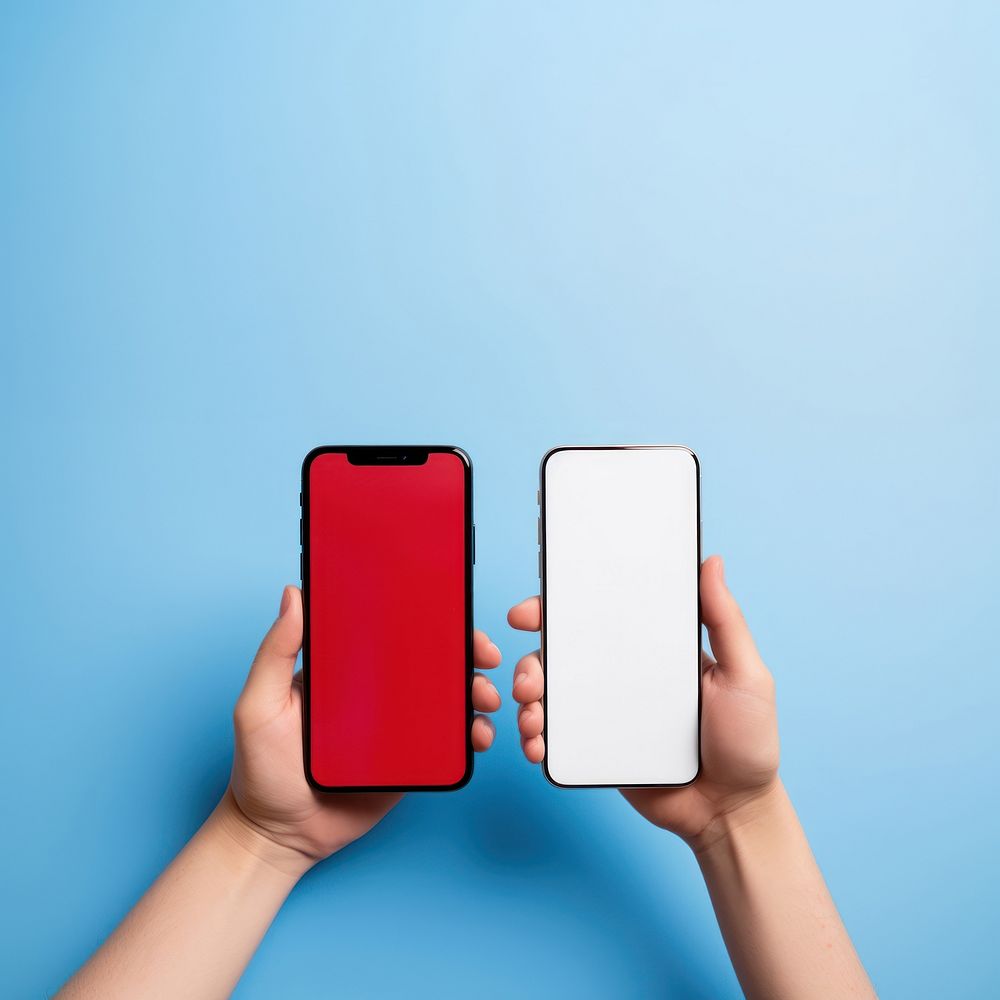 Hands holding smartphones hand red red background. AI generated Image by rawpixel.