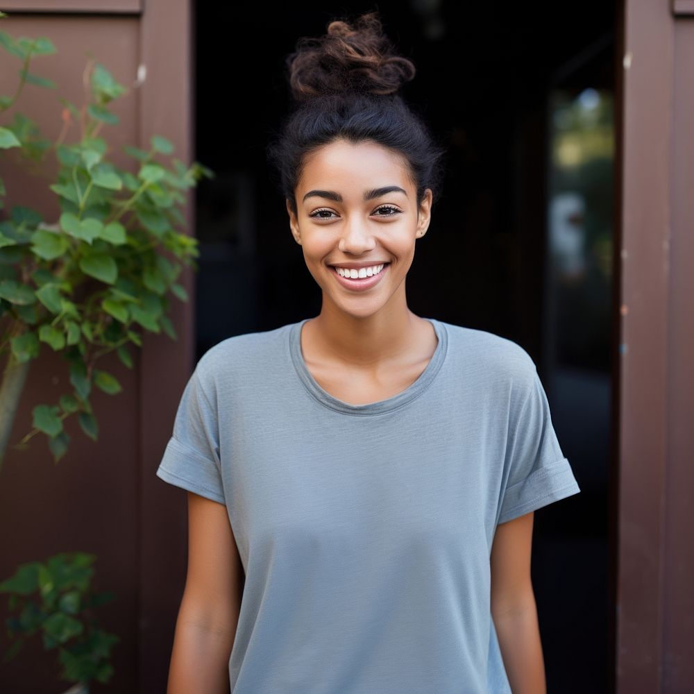 A girl with bun hair t-shirt smile happy. AI generated Image by rawpixel.