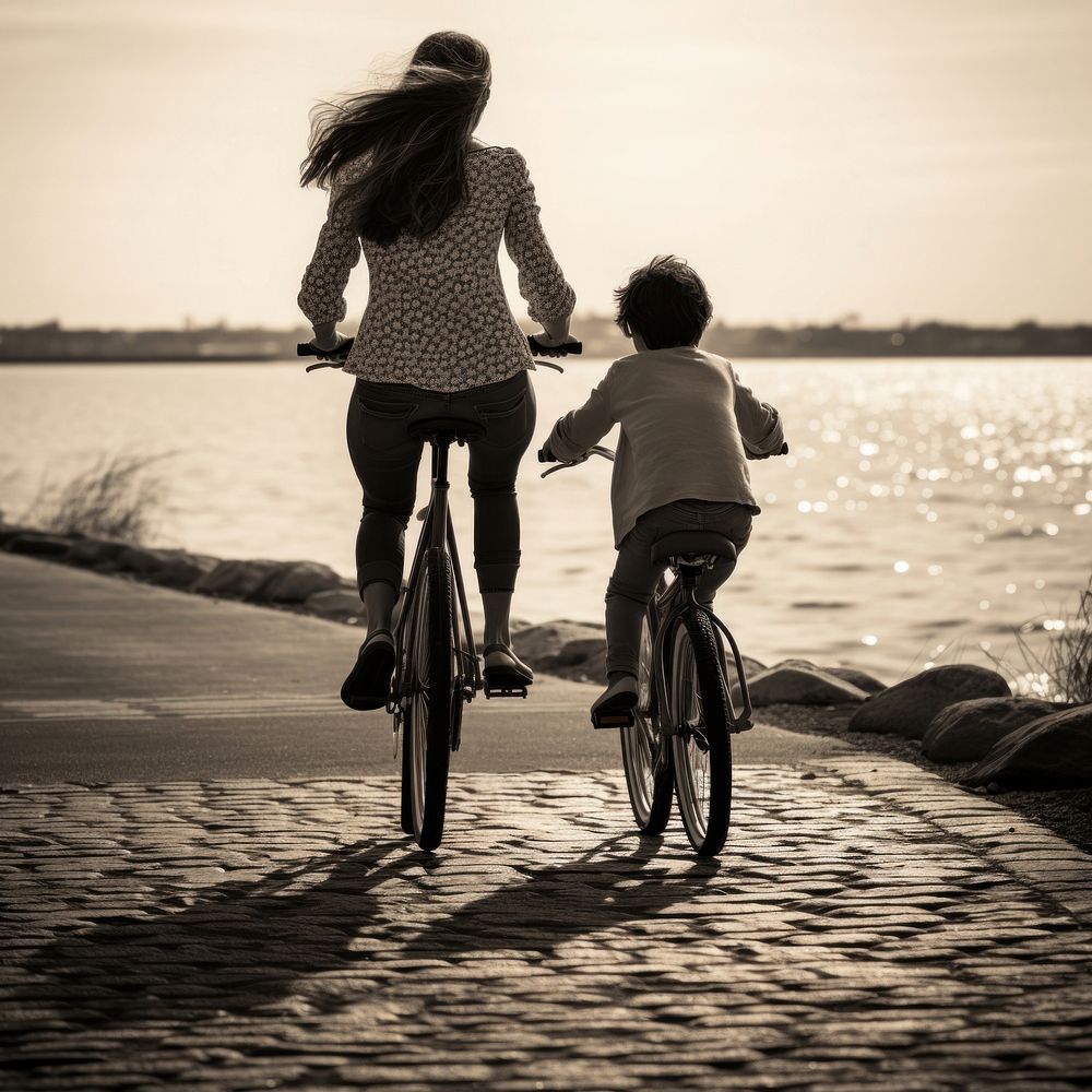 A mother and child on a bike on a riverside outdoors bicycle vehicle. AI generated Image by rawpixel.