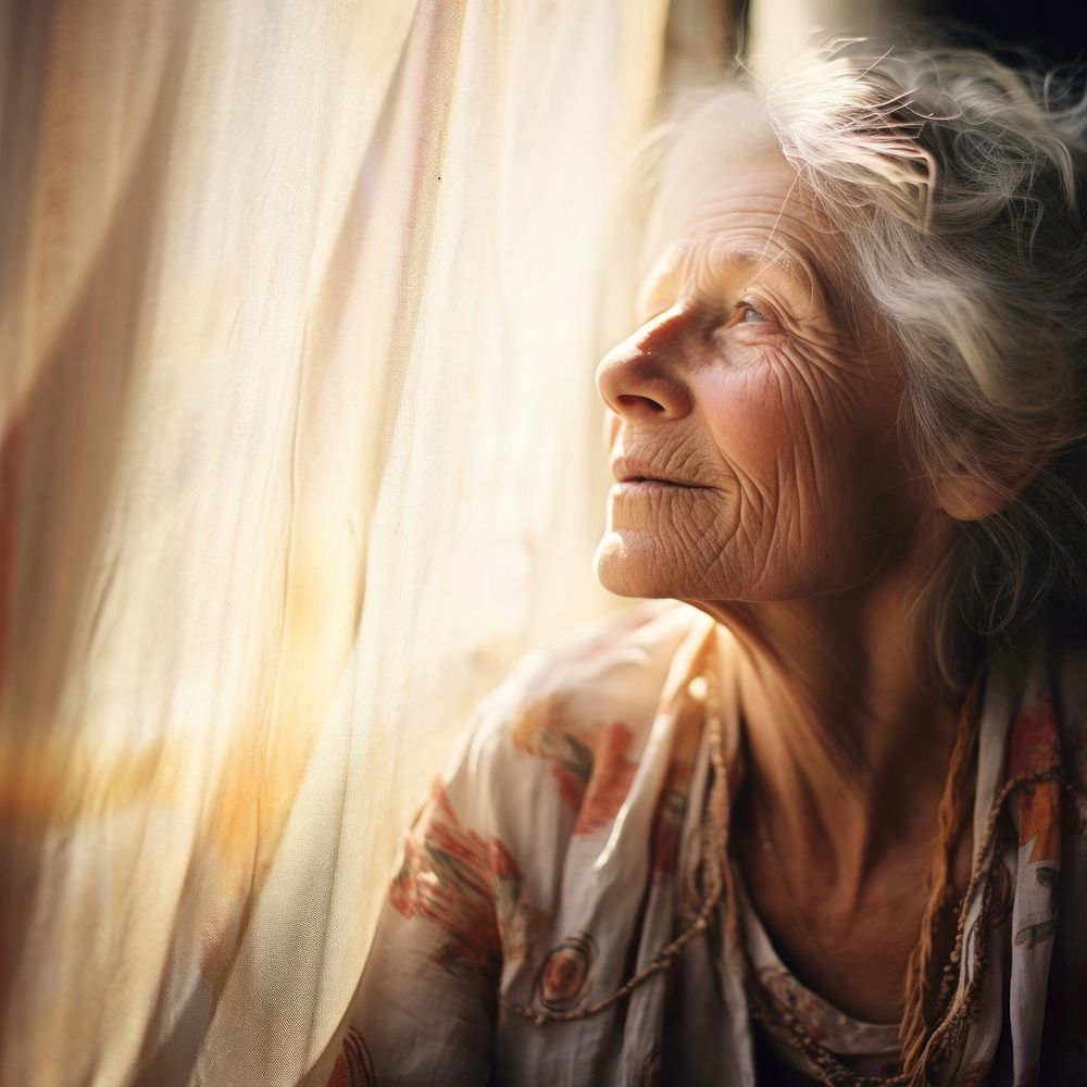 Artistic old woman portrait sunlight window. AI generated Image by rawpixel.