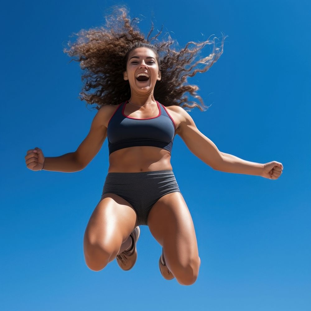 Frizzy young female athlete jumping sunny adult. 