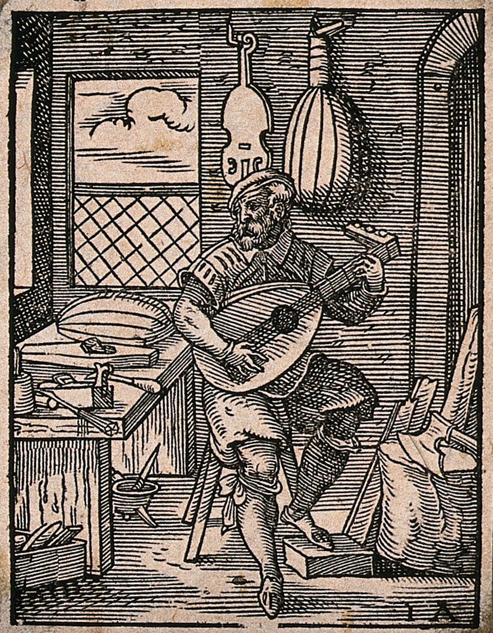 A lute-maker testing one of the lutes in his workshop: other musical instruments are hanging on the walls, and there are…