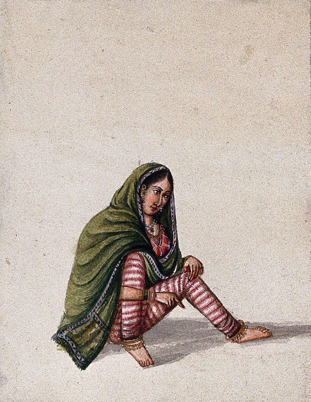 A woman in a green chunni (scarf) sitting and pointing to the ground. Gouache painting by an Indian artist.