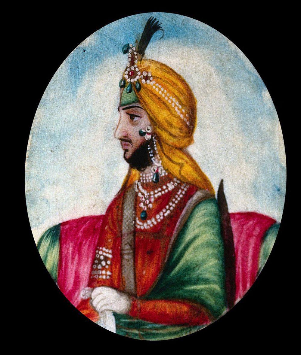 Maharajah Nounehatsingh  seated, wearing a richly decorated costume. Gouache painting.