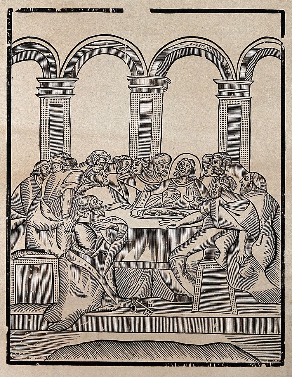 The Last Supper: Saint Peter kneeling in front of the table, Judas sits at the extreme right. Woodcut.