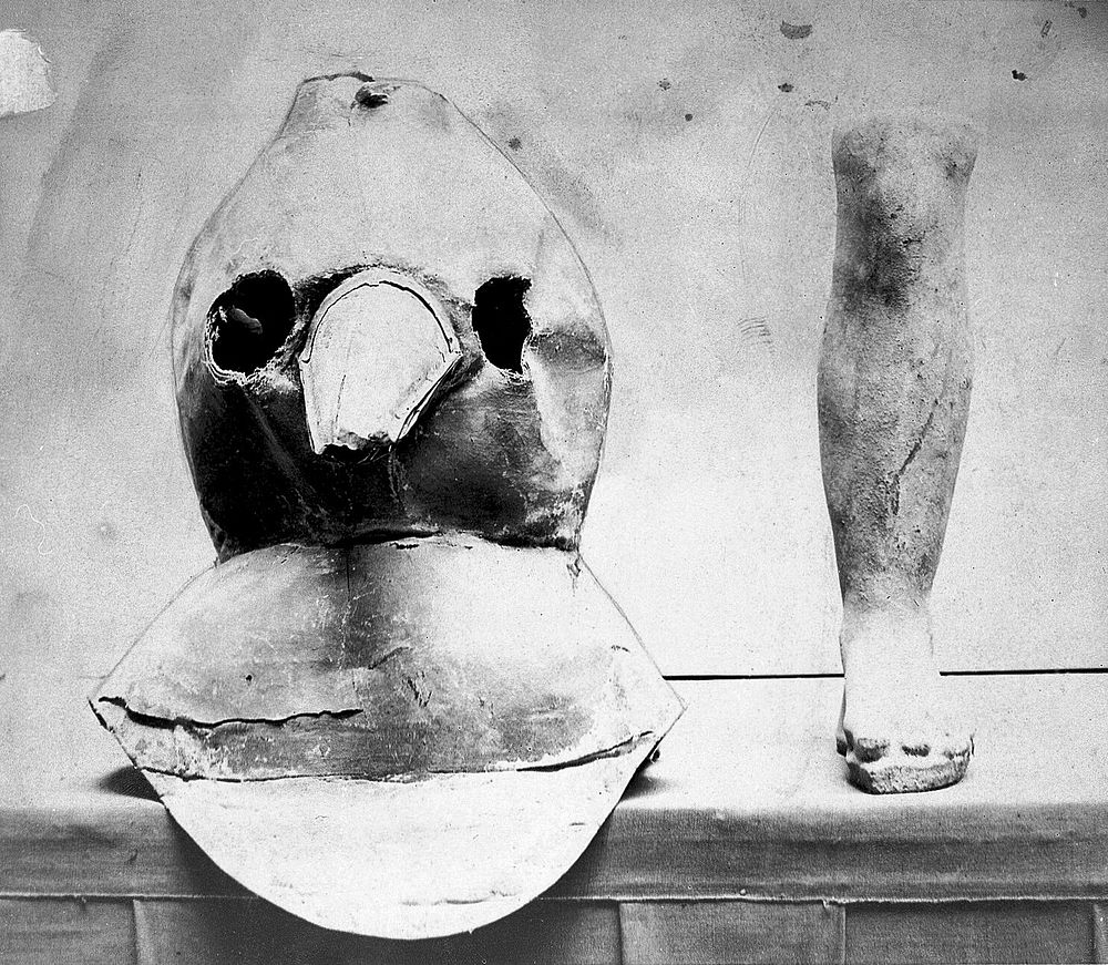 Plague apparatus from a lazaretto in Venice: an oil cloth mask with a bronze beak and a terracotta model of a foot and leg.…