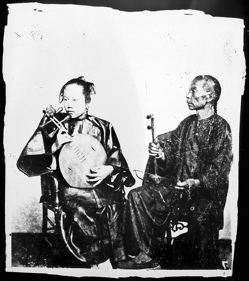 Two Chinese musicians with their instruments, Canton, Kwangtung province, China