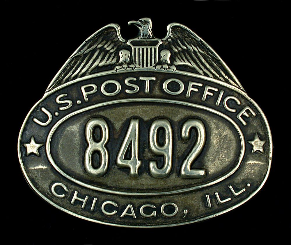 City letter carrier cap badge, number 8492