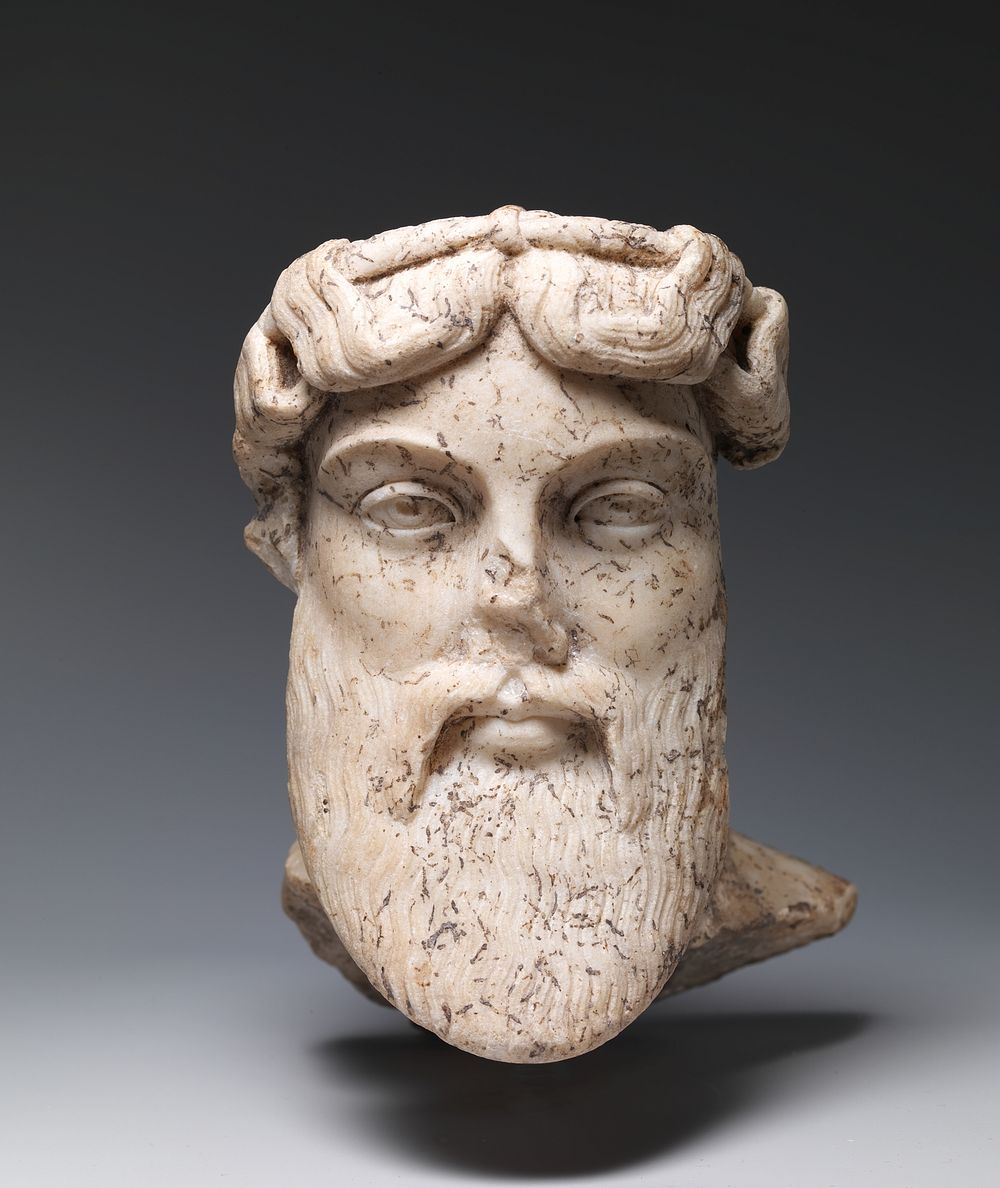 Marble head of a god, probably Dionysos