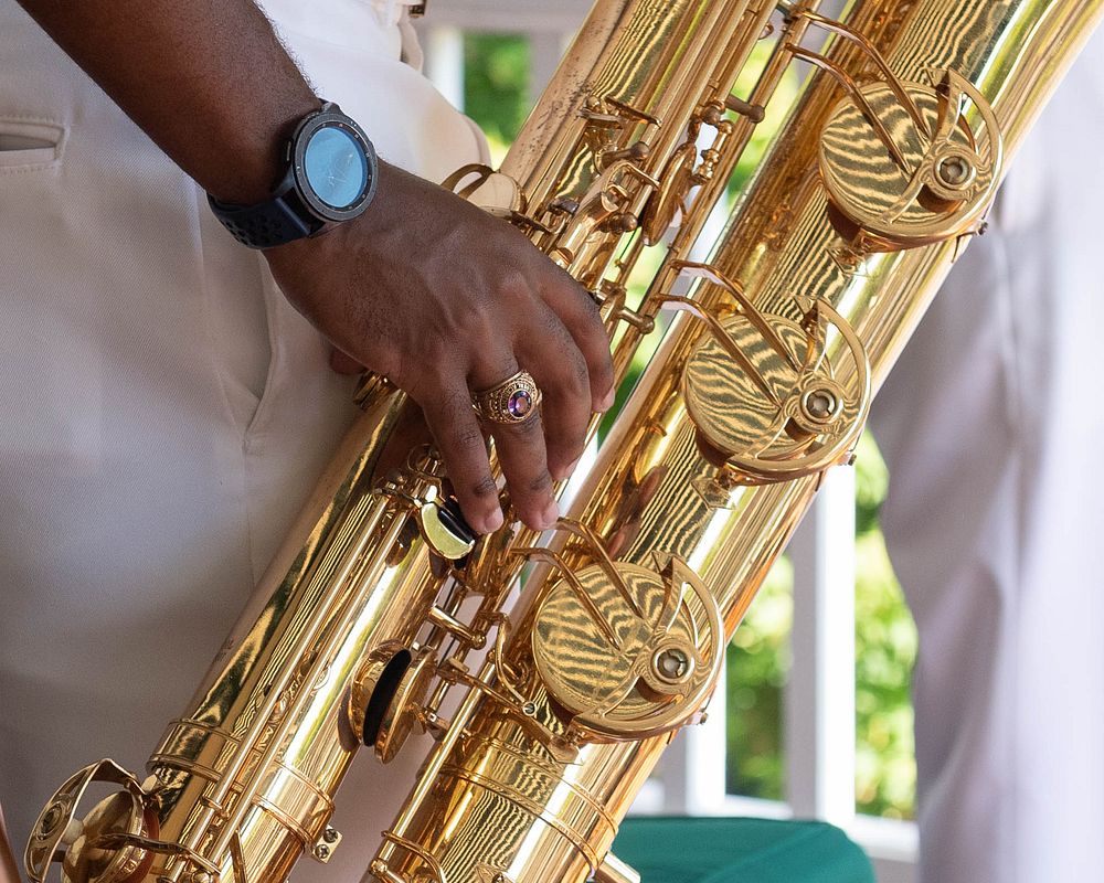 Baritone saxophone, closeup shot, musician. Original public domain image from Flickr