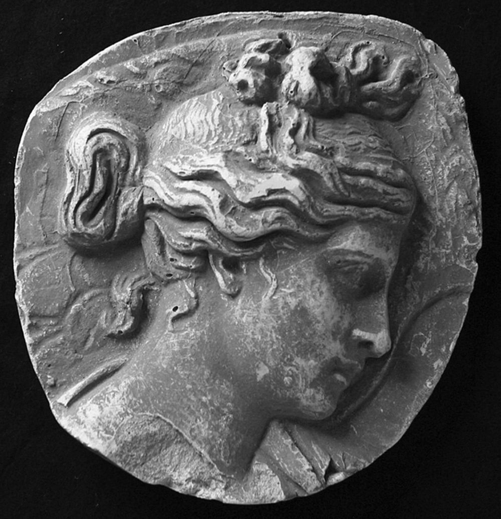 Trajan's column.Female head, right profile