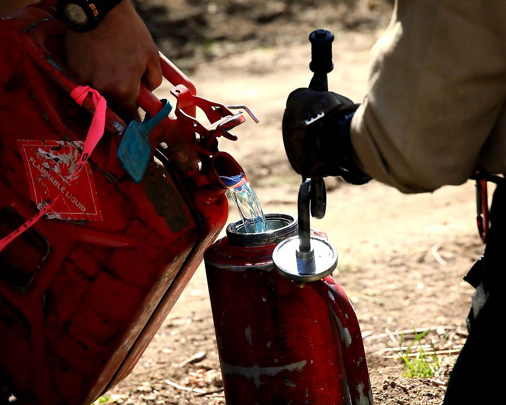 Fuels Management, Drip TorchesIn this photo firefighters are preparing drip torches to be used in a fuels management…