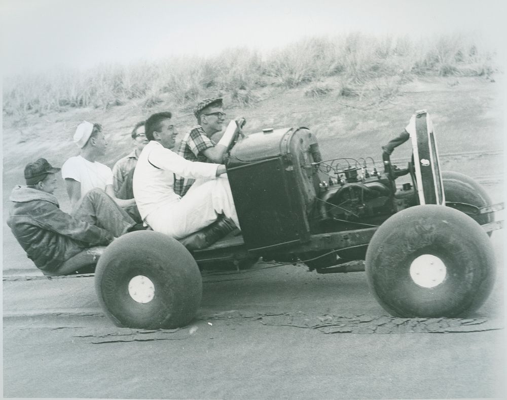 Men driving an antique car. | Free Photo - rawpixel