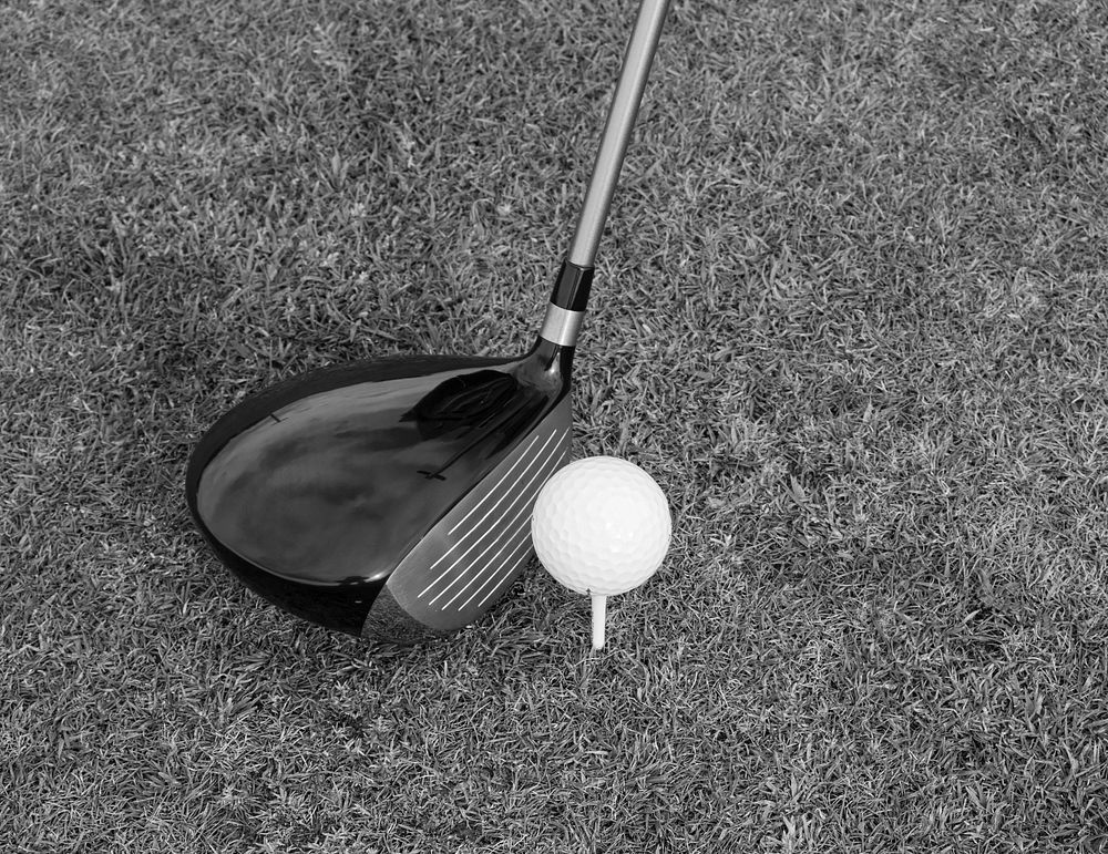 Closeup on golf club head and ball in grass. Free public domain CC0 image.