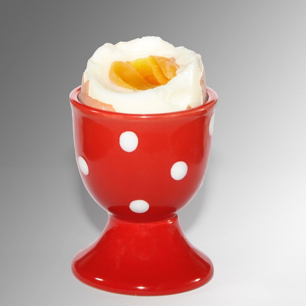 Boiled egg in cup. Free public domain CC0 photo.