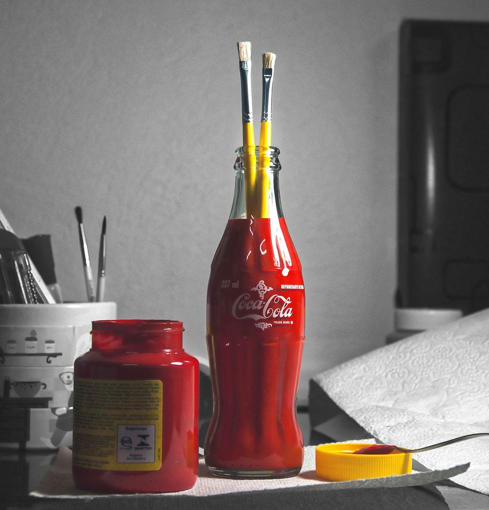 Paint red coke bottle, location unknown, date unknown