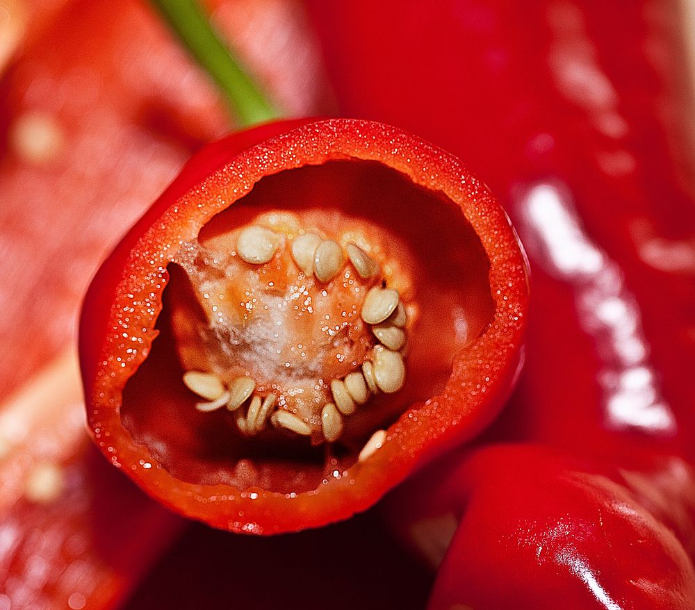 Closeup on cut open red chili. Free public domain CC0 image.