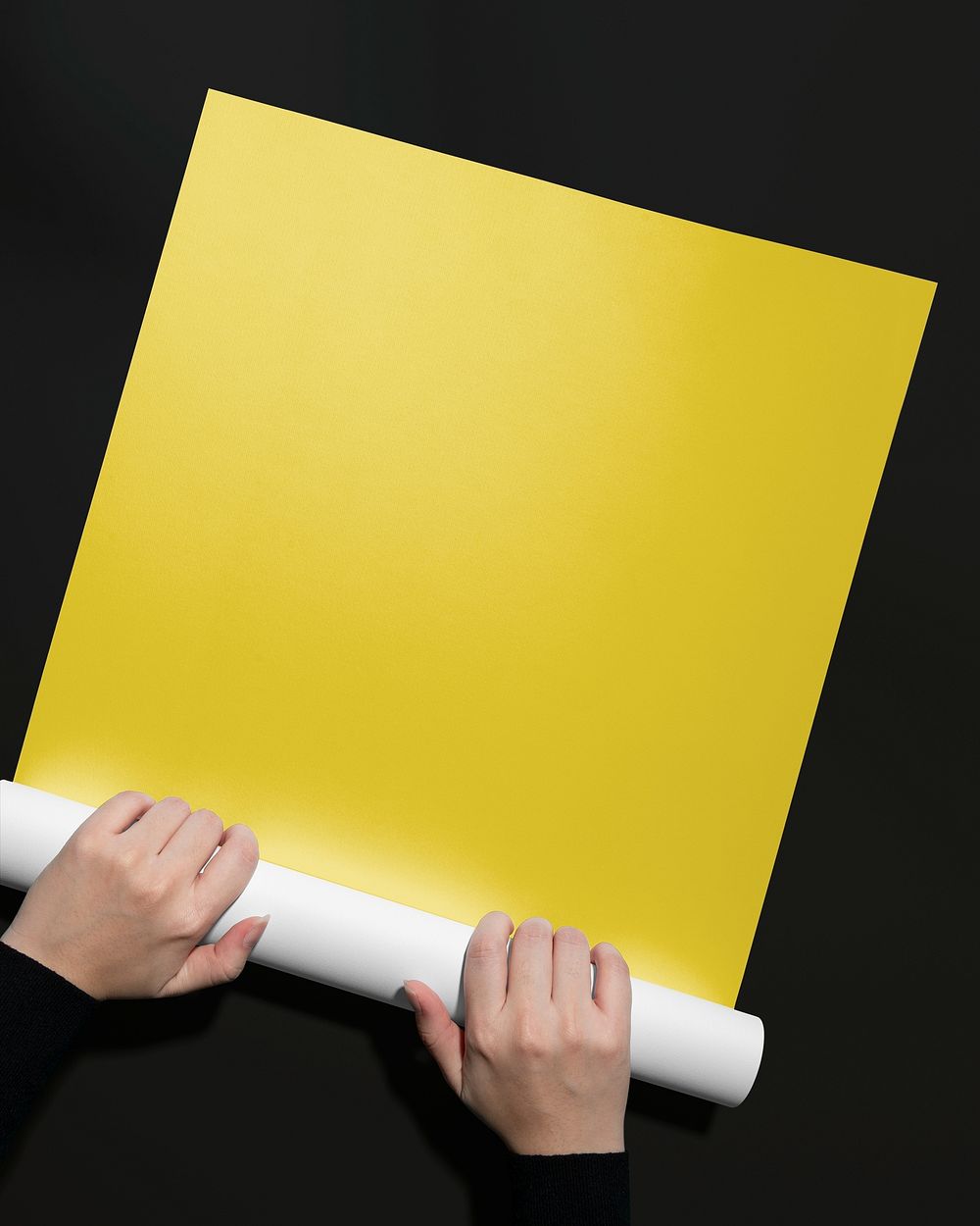 Blank yellow paper, held by hand, design space