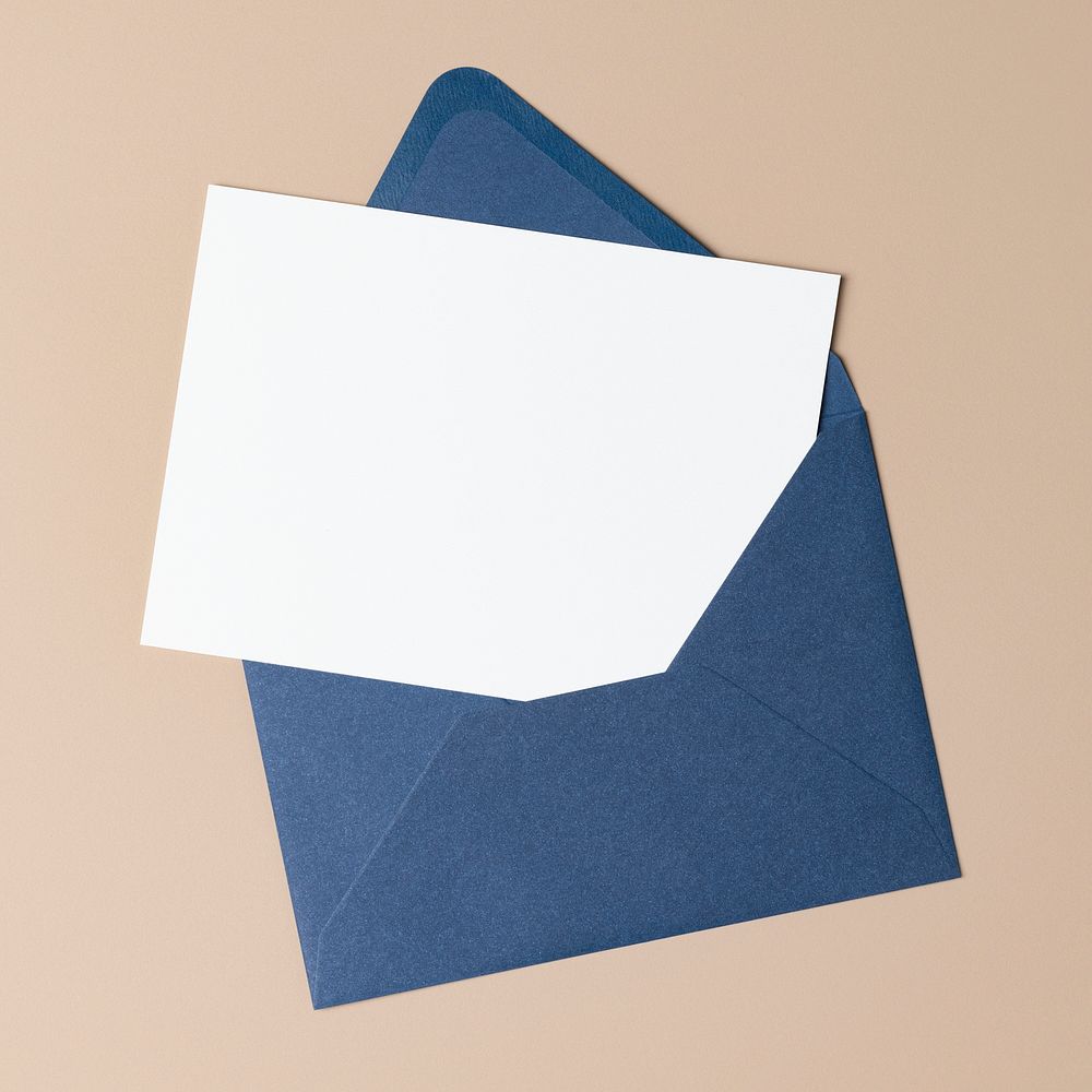 Blank white card, blue envelope, flat lay design