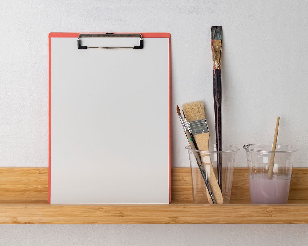 Blank paper on clipboard, artist workspace