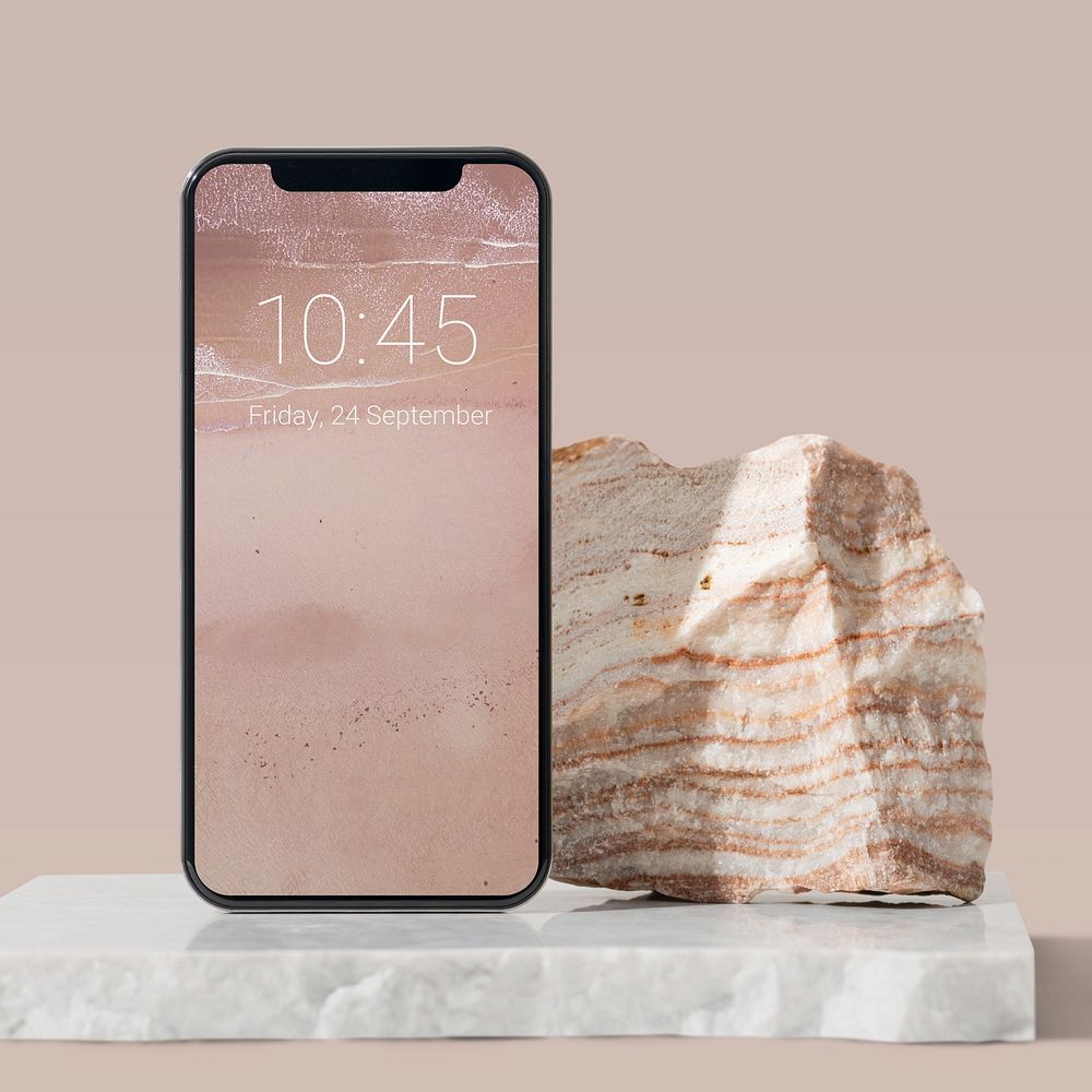 Lockscreen date on a smartphone screen, modern pink background