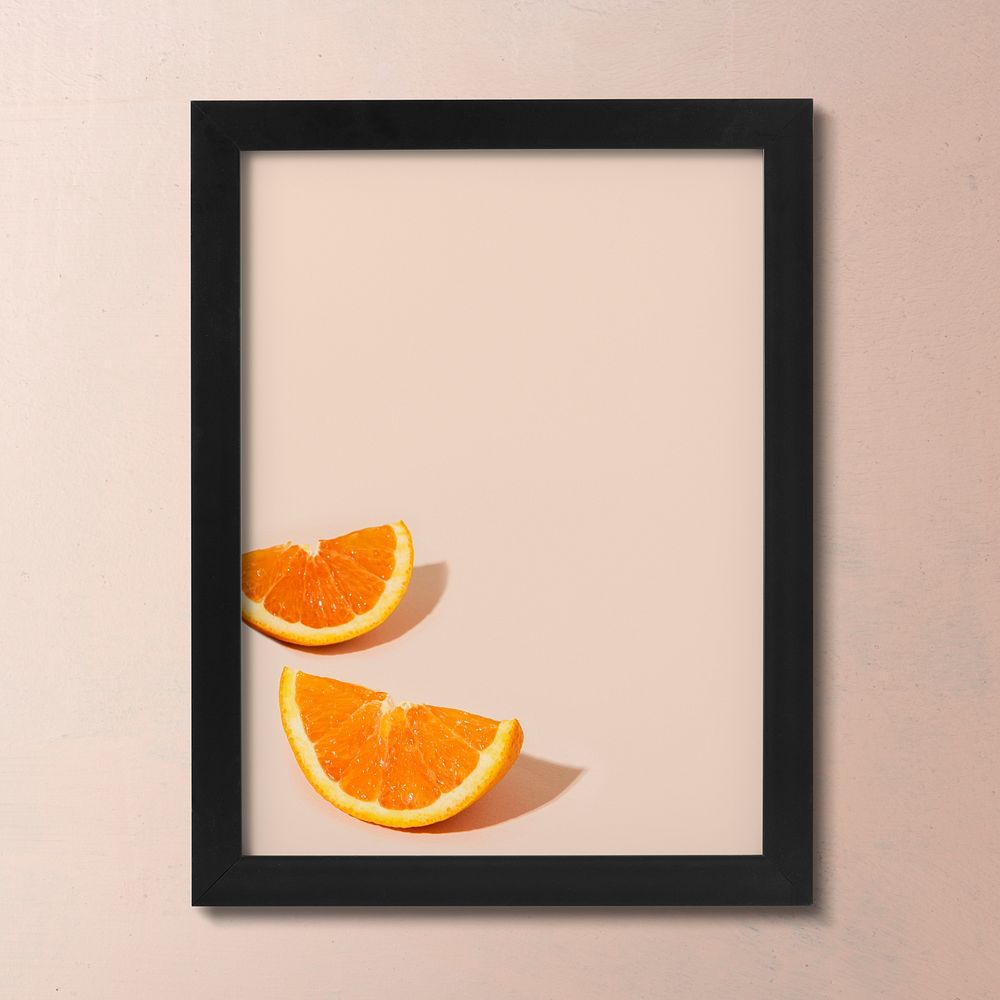 Black picture frame, summer orange photo, pink wall with design space