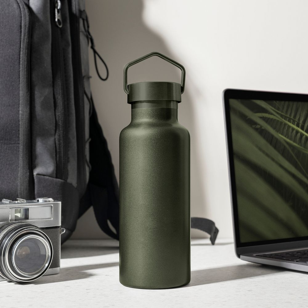 Green thermal bottle, minimal product in aesthetic workspace