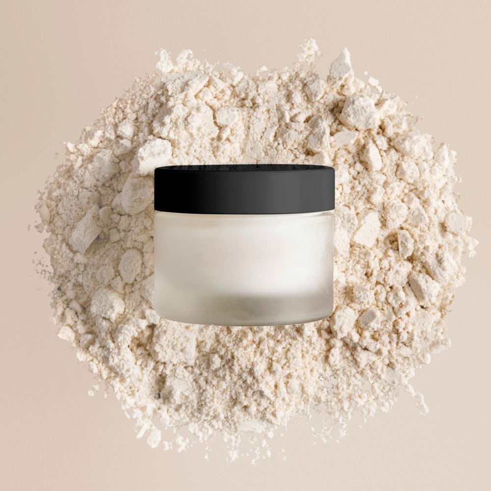 Blank glass jar, beige powder background, cosmetic product packaging design