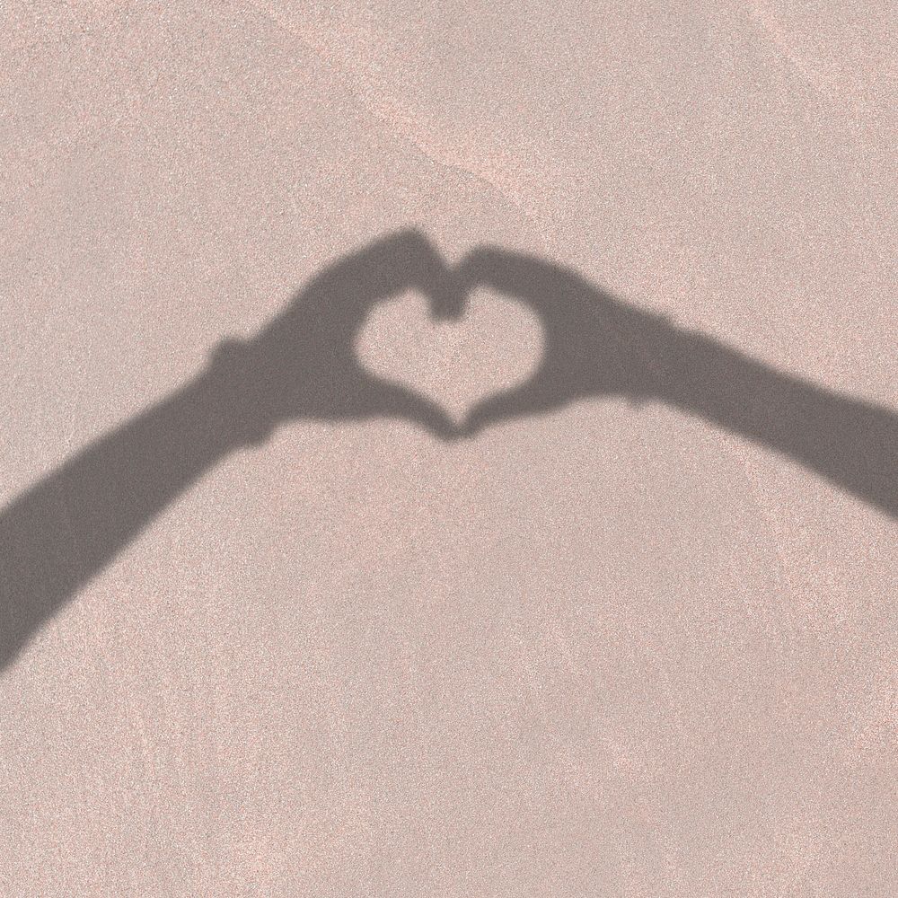 Heart sticker, couple shadow on sand illustration psd