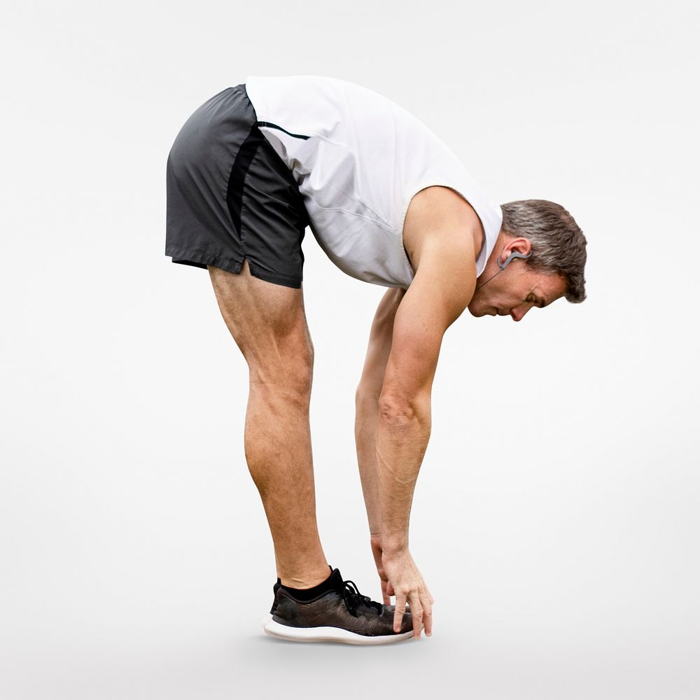 Man stretching in forward fold before exercise