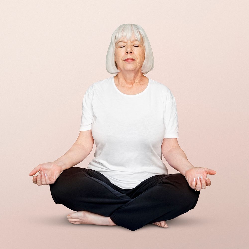 Senior woman meditating, full lotus pose