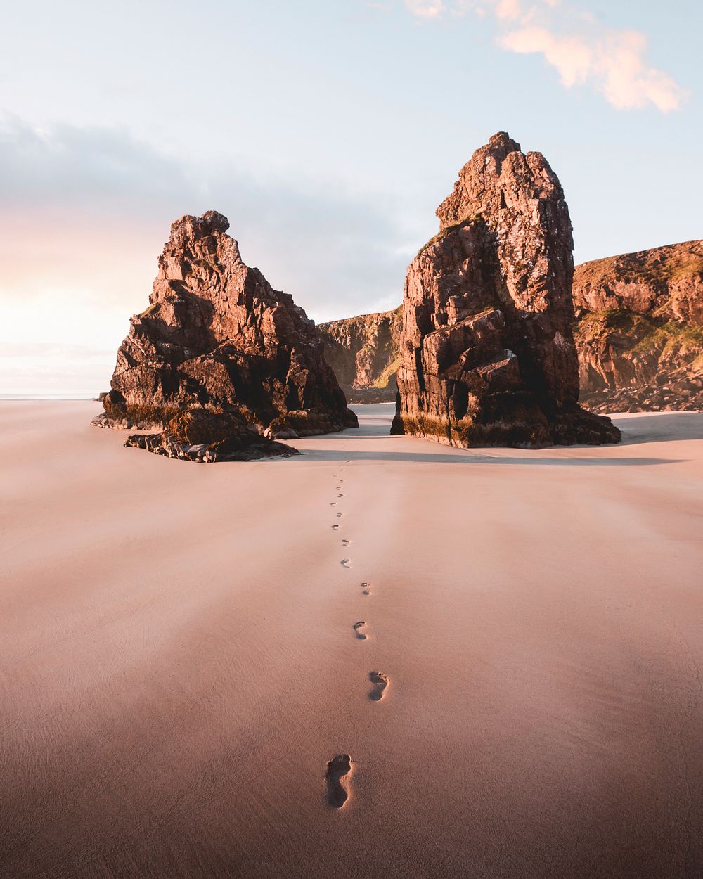 Footsteps on the sand passing through the outer Hebrides island, Scotland