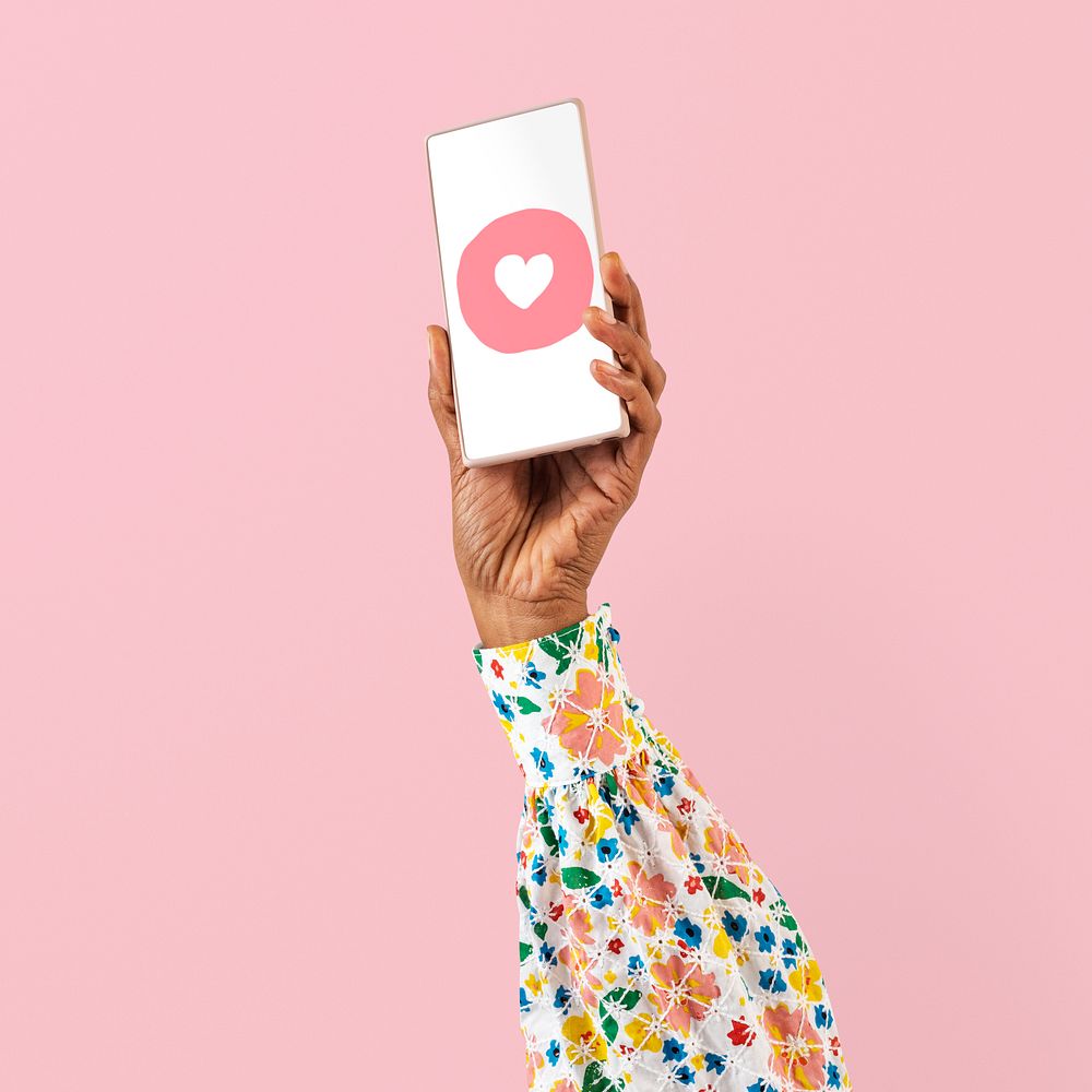 Smartphone screen hand mockup psd with social media heart icon