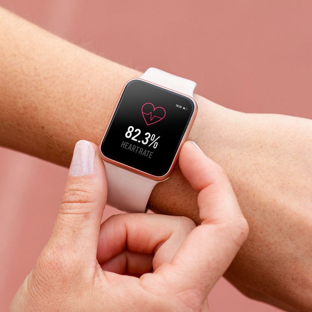 Pink smartwatch psd being used by a woman