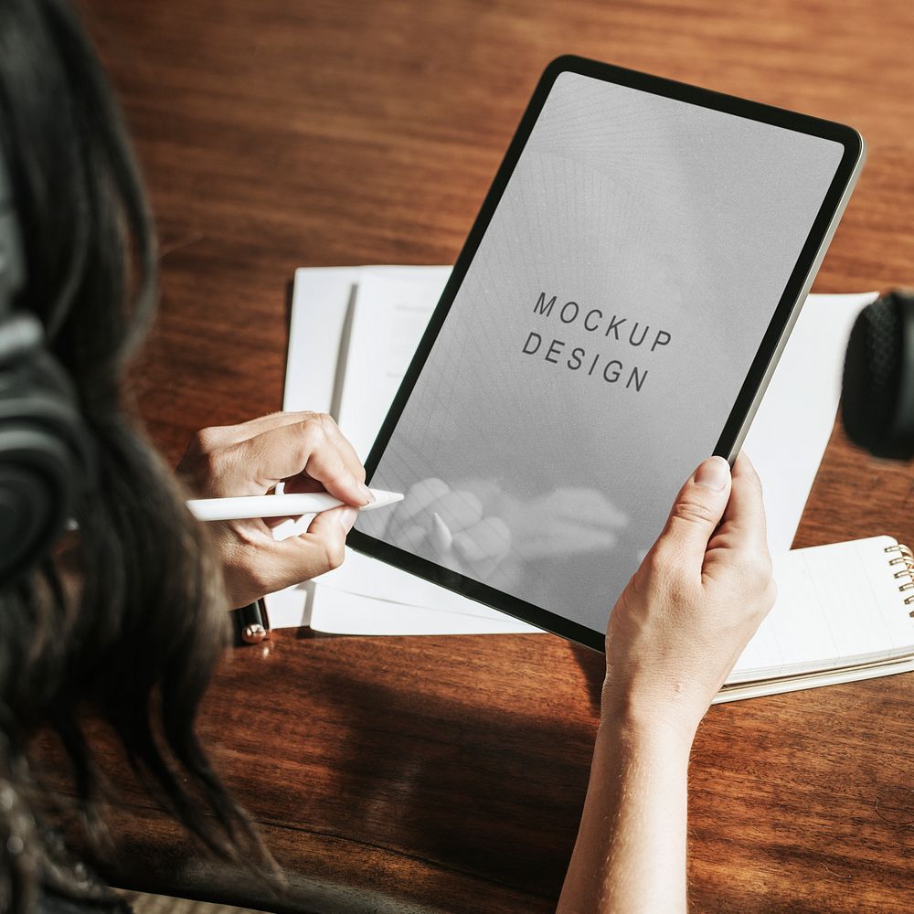 Woman writing on a digital tablet mockup mobile phone wallpaper