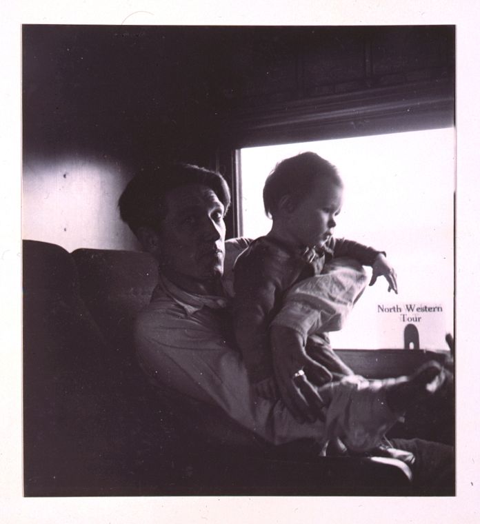 [Father and child on train]. Sourced from the Library of Congress.