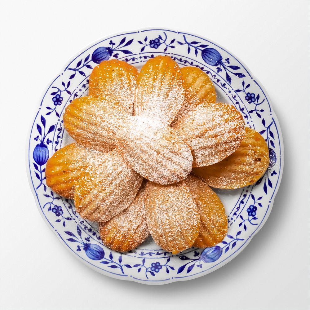 Madeleine biscuits on a plate, food photography, flat lay style