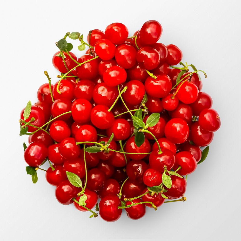 Red cherries on white background, food photography, flat lay style