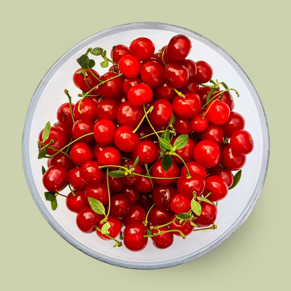 Cherries on a plate, fruit on green background, food photography